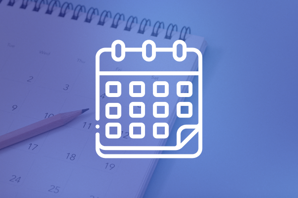 Calendar icon and pencil on desk.